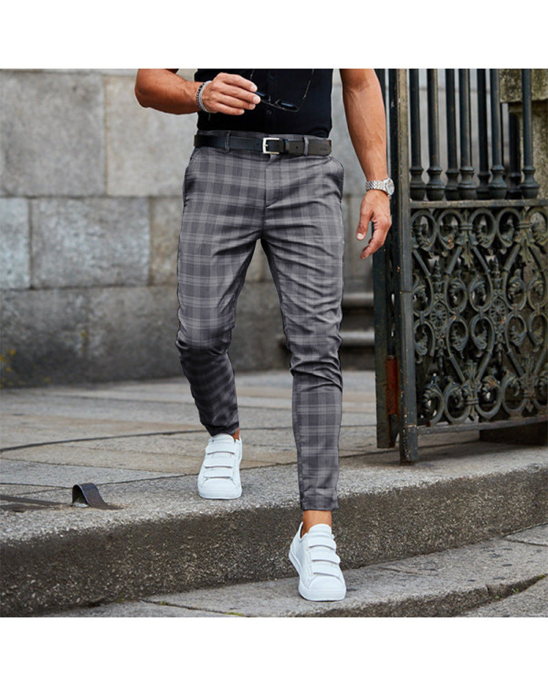 Mens Loose Fit Plaid Trousers in Dark Grey on a model, front view showing the plaid pattern and tapered legs