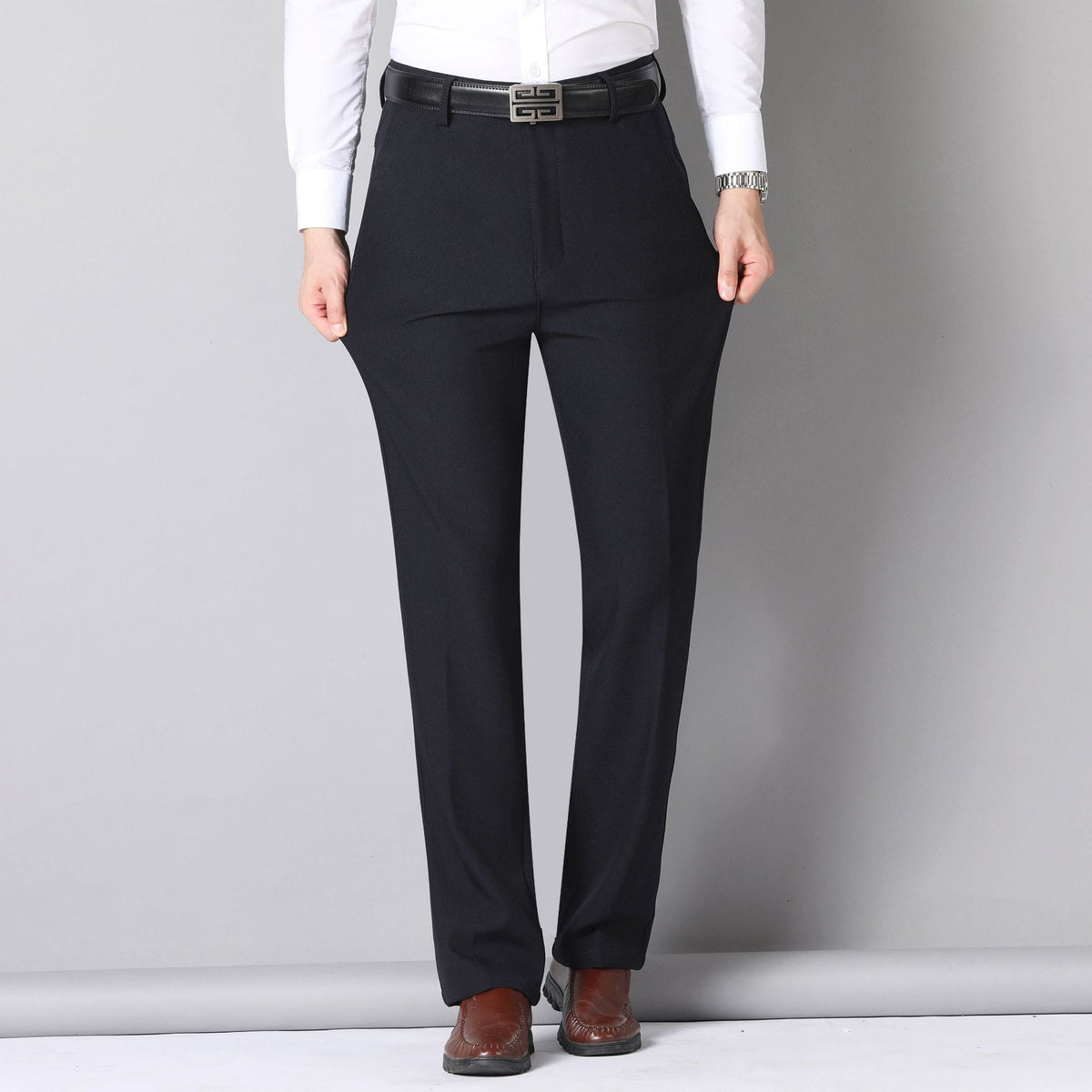 Mens Mid Rise Stretch Trousers , folded dark grey fabric with a close view of the pocket and stitching