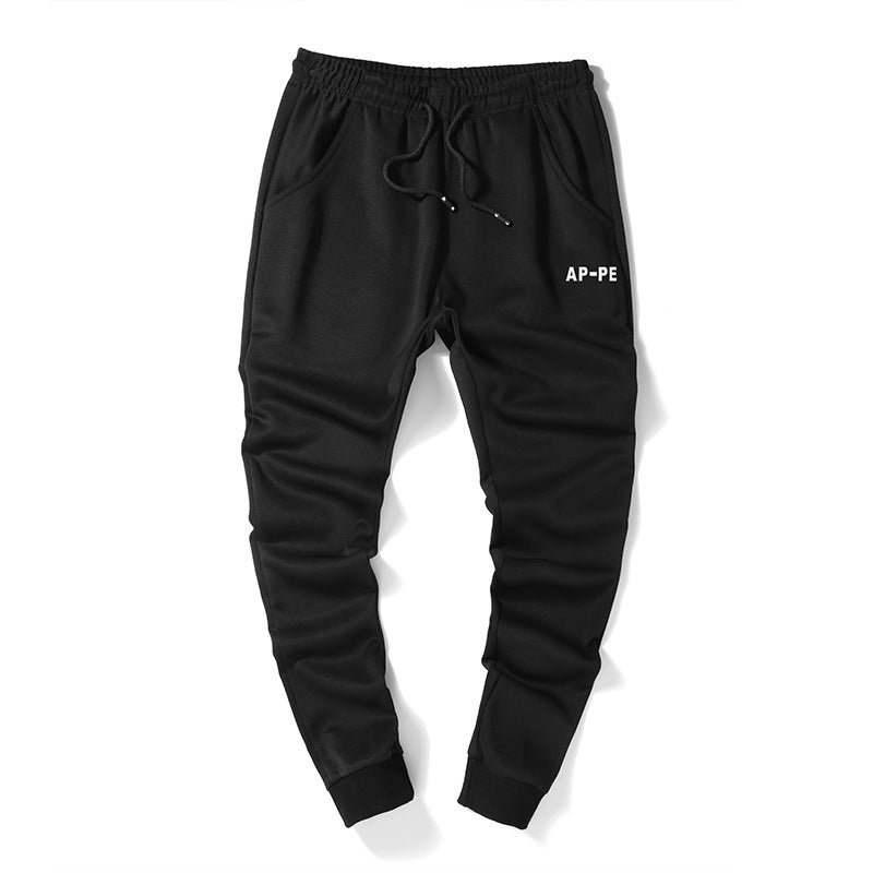 Mens Slim Fit Harem Pants in Black, front product view showing the drawstring waistband, side pockets and fitted ankle cuffs