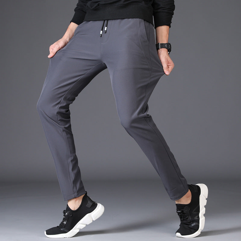 Mens Slim Fit Trousers in grey demonstrating flexible fabric and freedom of movement
