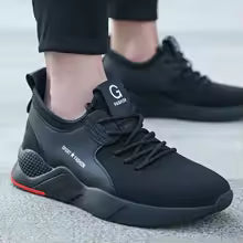 Mens Steel Toe Work Shoes Style 3 in black with lace-up fastening, broad side panels and a red heel accent, shown worn.