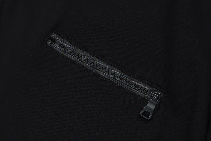 Mens Hip Hop Cotton Trousers in Black, close-up showing the pocket zipper and fabric detail
