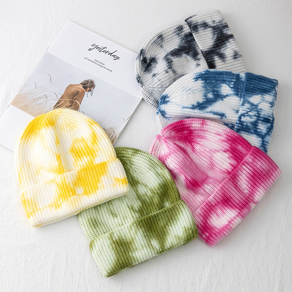Unisex Tie Dye Beanie collection showing yellow, green, pink, blue and black patterned hats with ribbed knit and folded cuffs