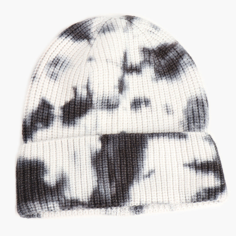 Unisex Tie Dye Beanie in Black and white, front view showing the ribbed knit, rounded crown and folded cuff