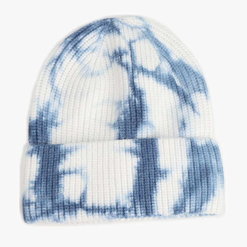 Unisex Tie Dye Beanie in Navy Blue and white, front view showing the patterned ribbed knit and folded cuff