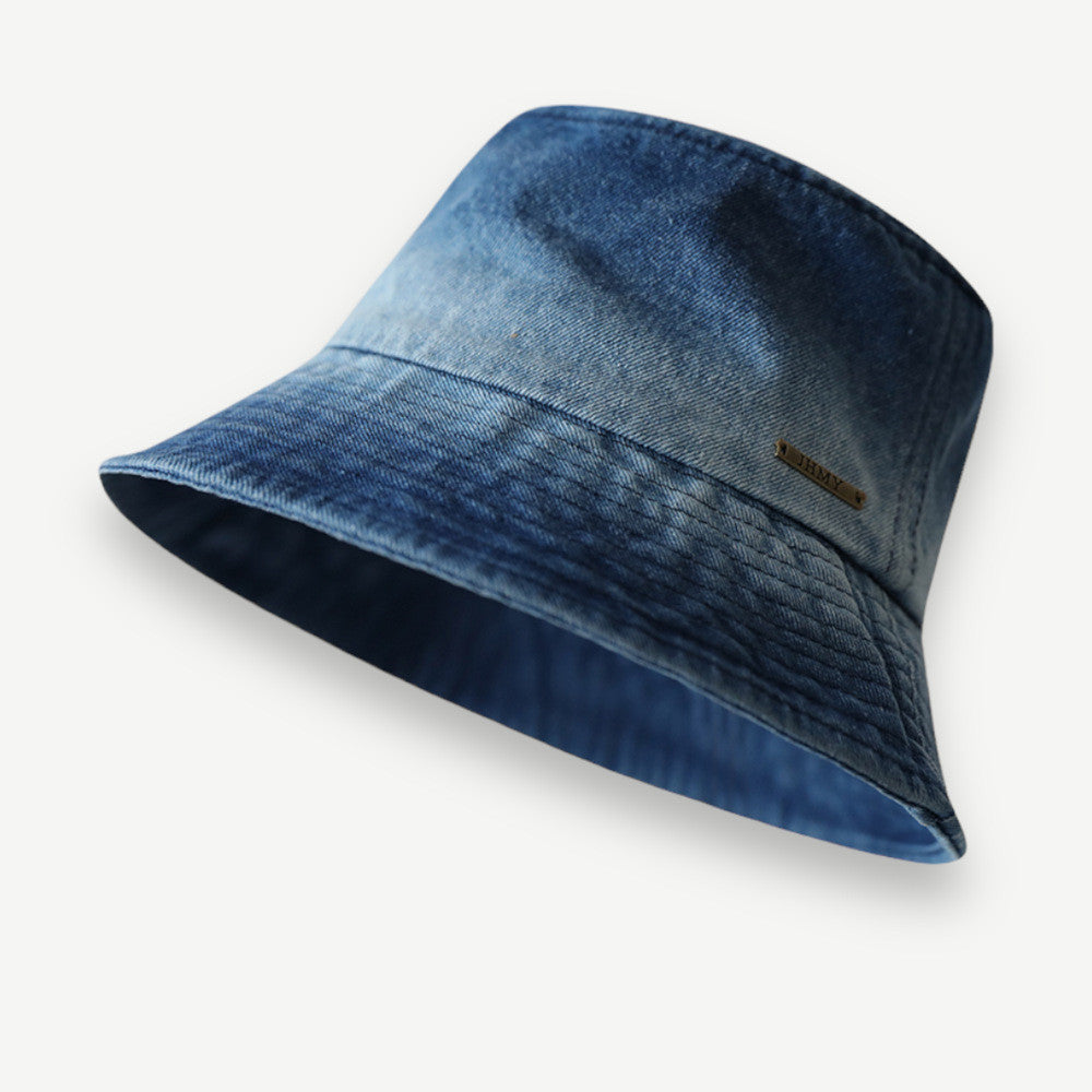 Vintage Washed Bucket Hat in dark denim blue with a faded finish and downward-sloping stitched brim.