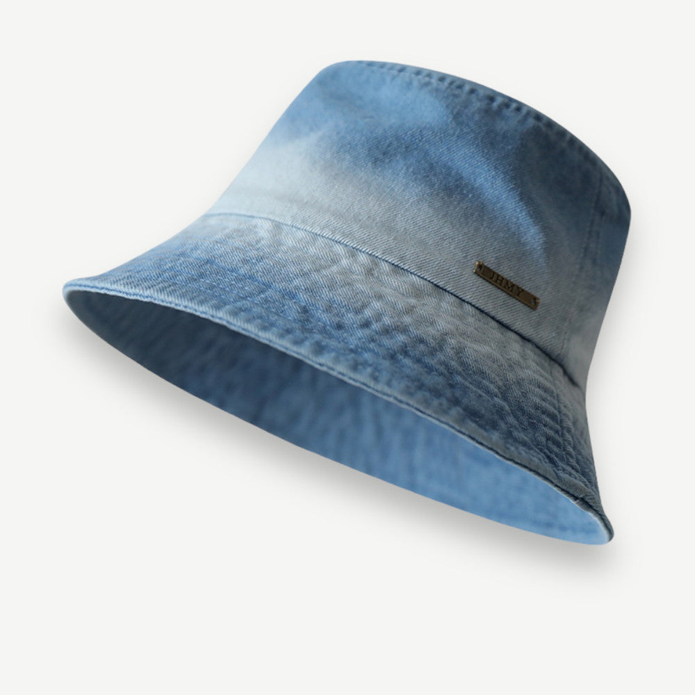 Vintage Washed Bucket Hat in medium denim blue with a flat crown, washed texture and short brim.