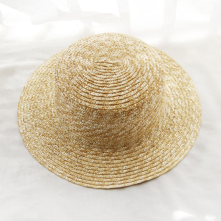 Womens Boater Straw Hat in natural straw tones with a rounded crown and undecorated woven brim.