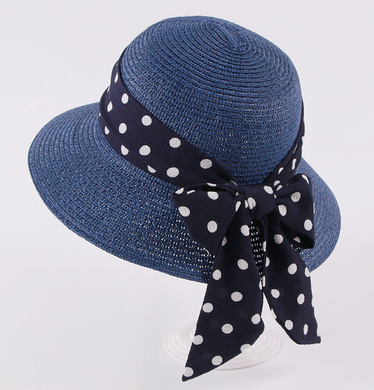 Womens Bow Sun Hat in navy blue with a dark ribbon bow featuring white polka dots.
