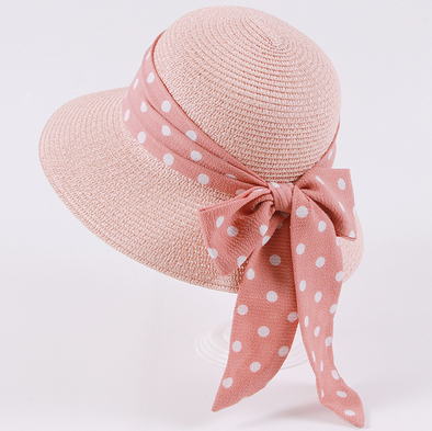 Womens Bow Sun Hat in pink with a matching pink ribbon bow featuring white polka dots.
