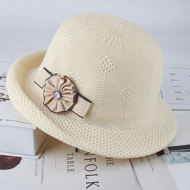 Womens Floral Knit Sun Hat in cream with a rounded crown and a beige rosette and ribbon decoration.