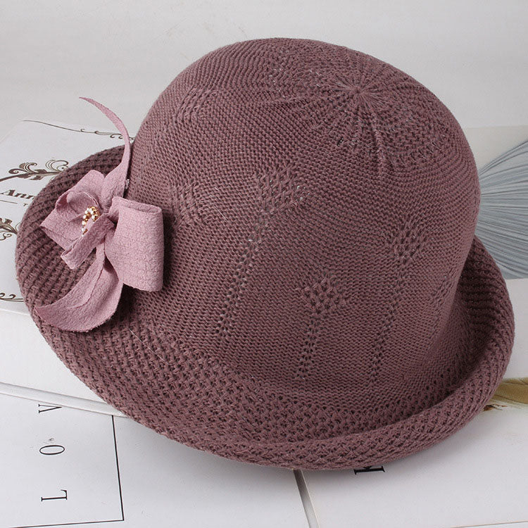 Womens Floral Knit Sun Hat in mauve with a rounded crown, curled brim and matching decorative bow.