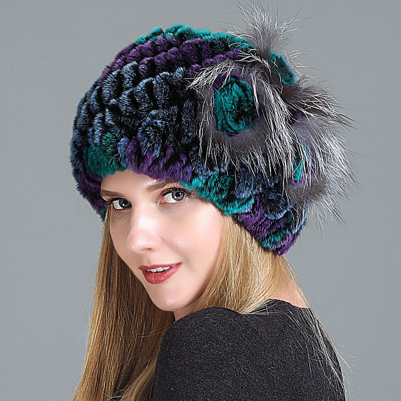 Womens Fur Knitted Hat in dark blue, purple and teal tones with a decorative side flower
