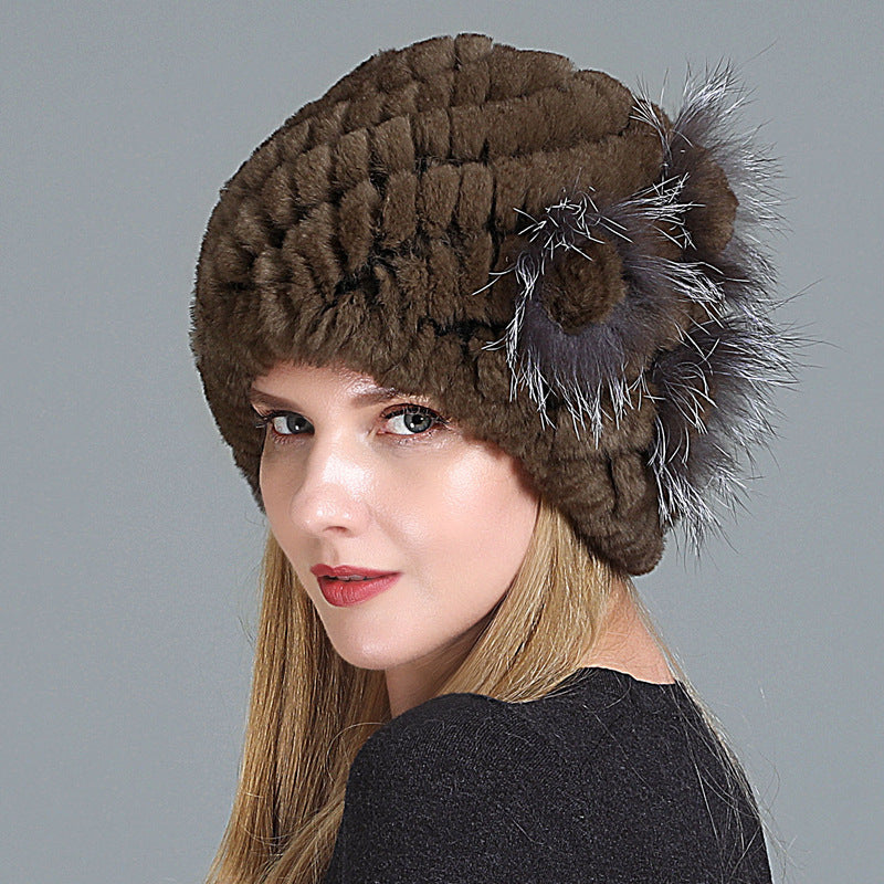 Womens Fur Knitted Hat in dark brown with textured rows and a decorative side flower.