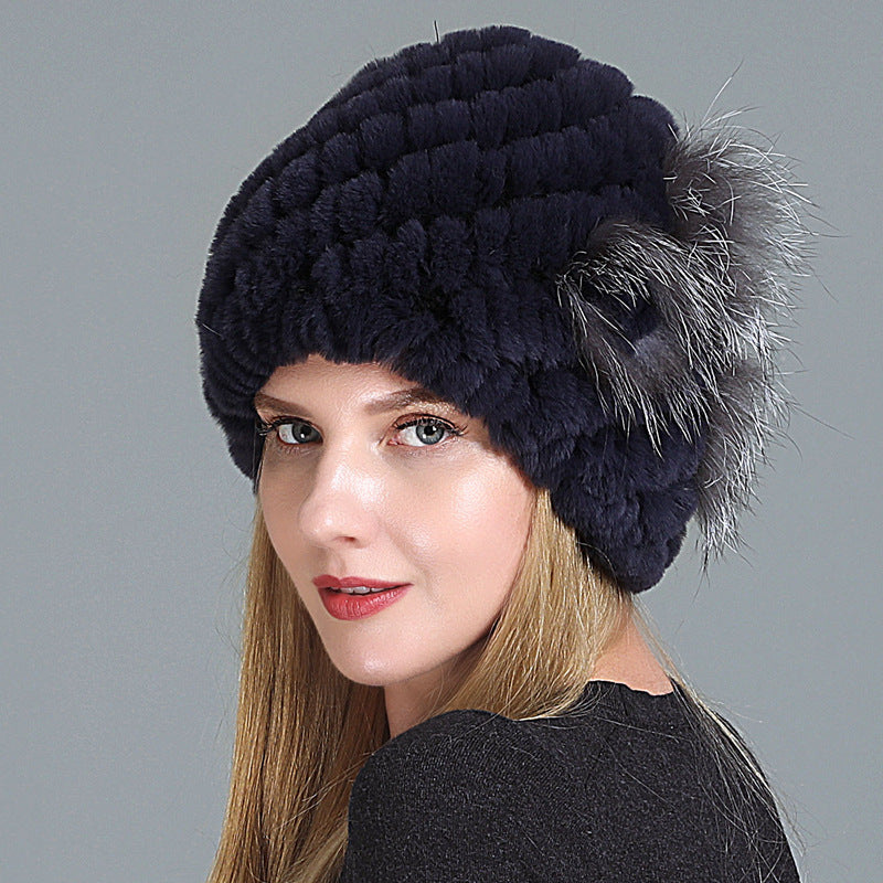 Womens Fur Knitted Hat in dark navy with a textured surface and contrasting grey side decoration.