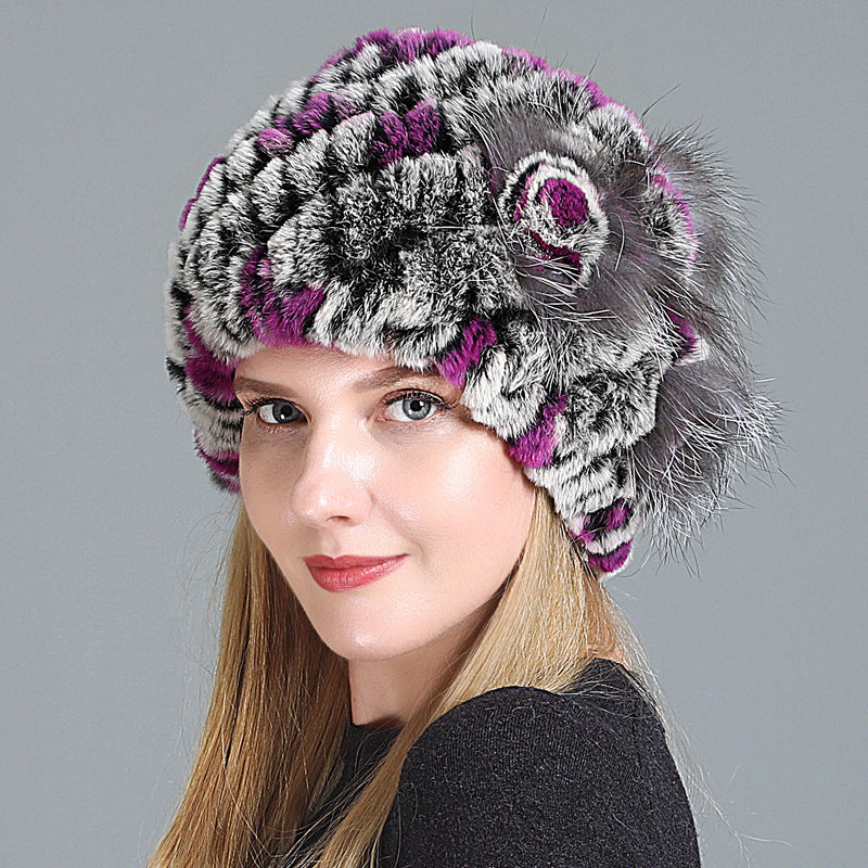 Womens Fur Knitted Hat in grey with purple accents and a matching decorative side flower.