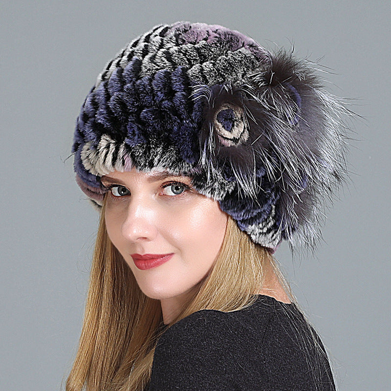 Womens Fur Knitted Hat in navy and grey with contrasting textured rows and a decorative side flower.