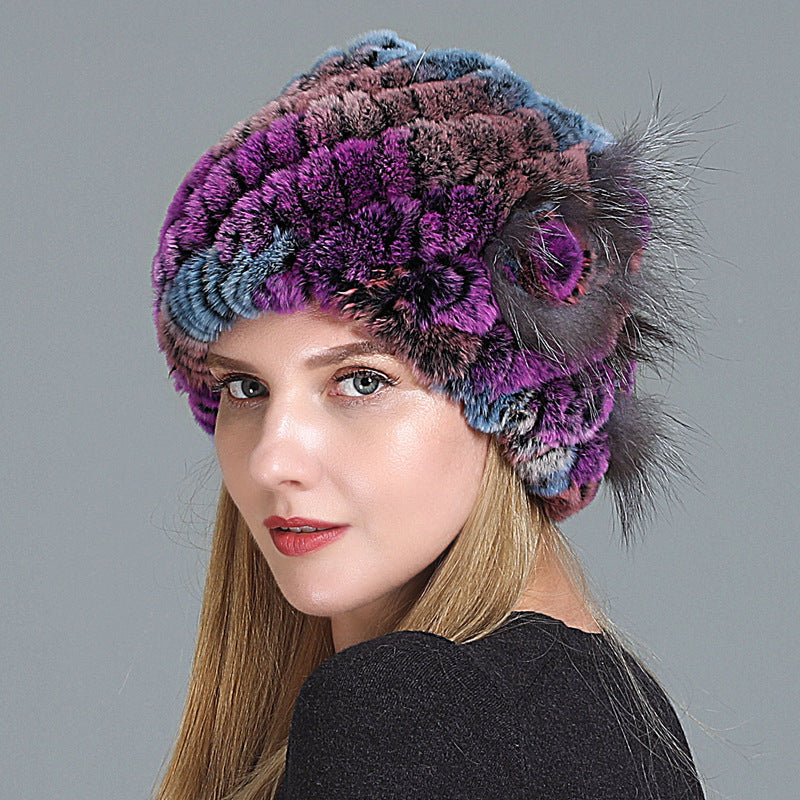 Womens Fur Knitted Hat in purple, blue and brown tones with a matching decorative side flower.