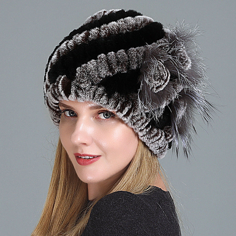Womens Fur Knitted Hat with black and grey horizontal stripes and a decorative side flower.