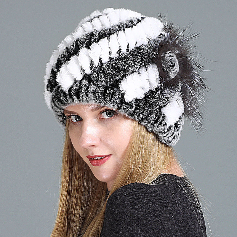 Womens Fur Knitted Hat with white and dark grey stripes and a decorative side flower.