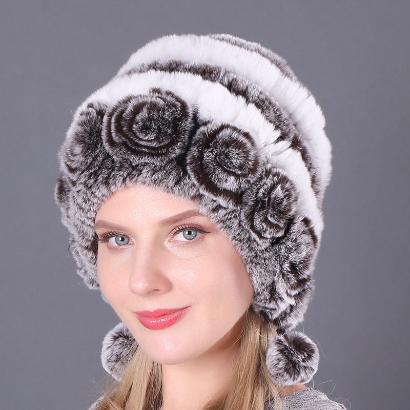 Womens Rabbit Fur Hat with white and grey stripes, grey floral details and matching hanging pom-poms.