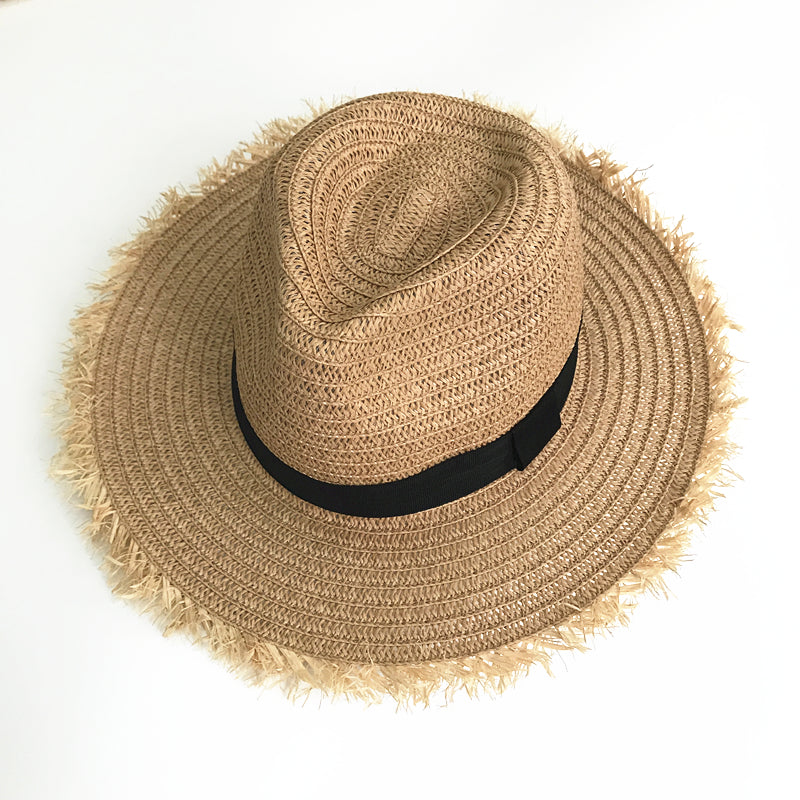 Womens Raffia Straw Hat in Khaki, angled top view showing the shaped crown, black hatband and wide frayed brim