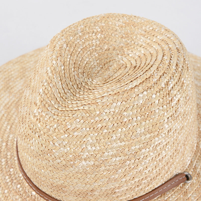 Womens Wide Brim Straw Hat close-up of the shaped crown, natural straw weave and brown strap detail.