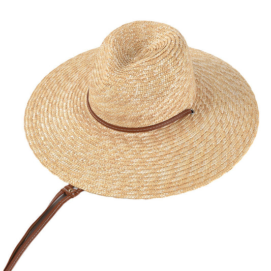 Womens Wide Brim Straw Hat in natural colour, showing the shaped crown, woven brim and brown strap detail.
