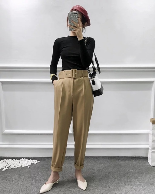 Belted High Waist Trousers in khaki styled with a black long-sleeved top and light-coloured shoes