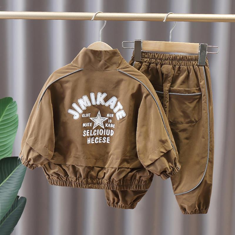 Boys Sports Two-Piece Suit in chocolate brown showing printed jacket and coordinated trousers