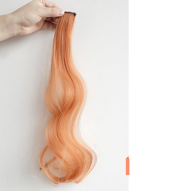 Curly Face-Framing Hair Extensions in orange with long soft curls