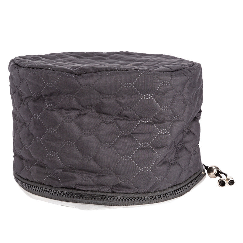 Two-speed tempering hair heating cap in black.