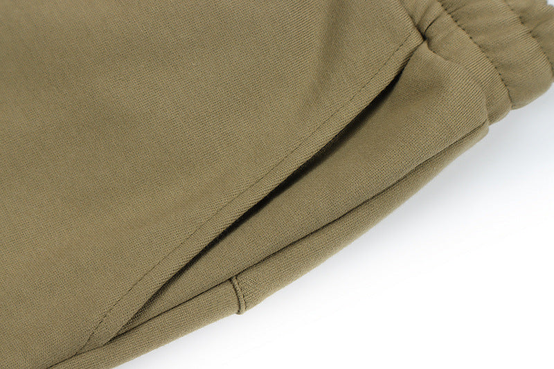 Mens Hip Hop Cotton Trousers in Green, close-up showing the pocket zipper and fabric detail