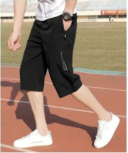 Mens Quick Dry Cropped Pants in black loose fit on model