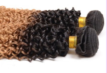 Ombre Curly Human Hair Extensions displayed as bundled curly wefts