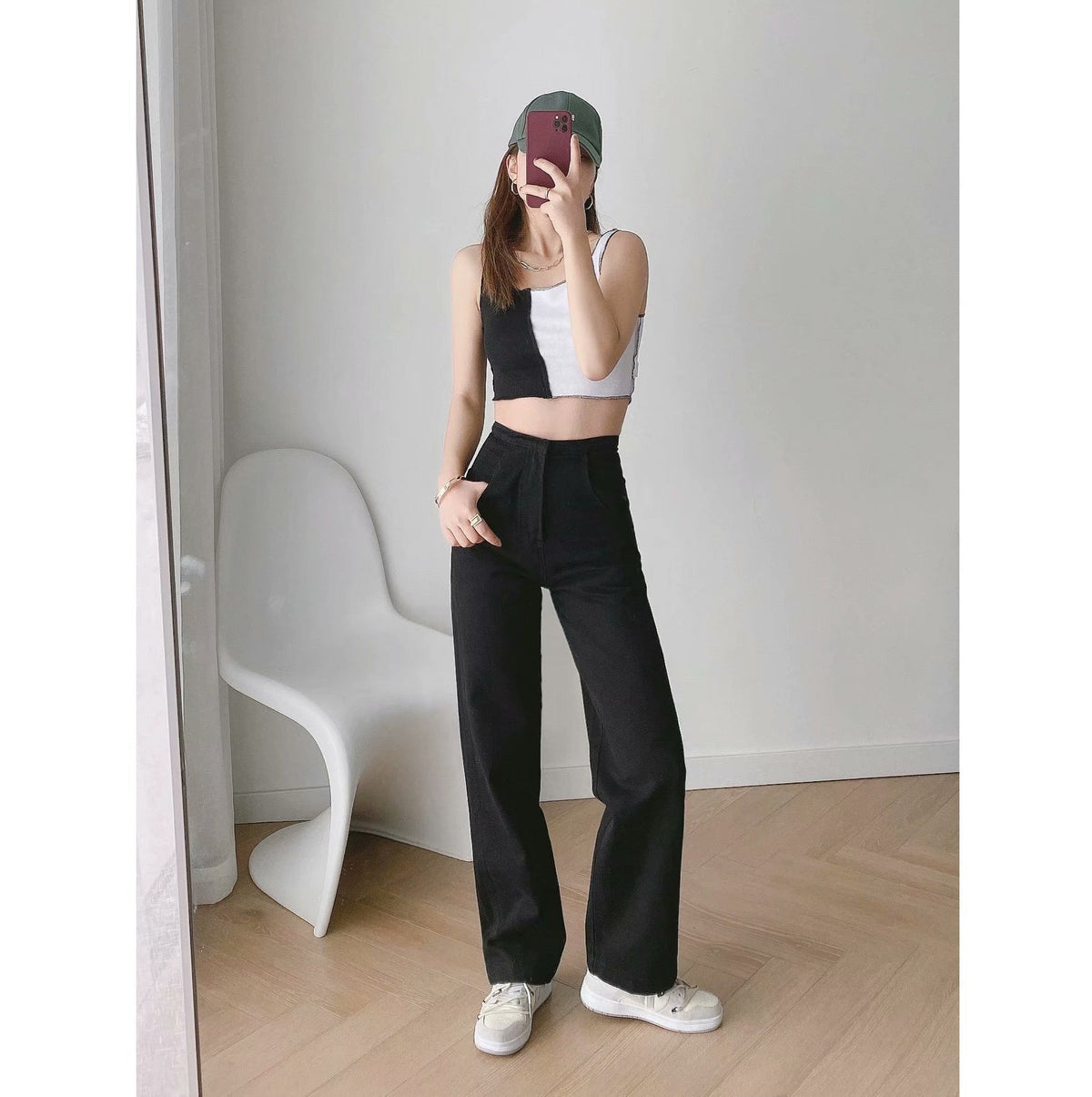 Womens Banana Pants in black with a relaxed straight-leg silhouette and casual sneakers