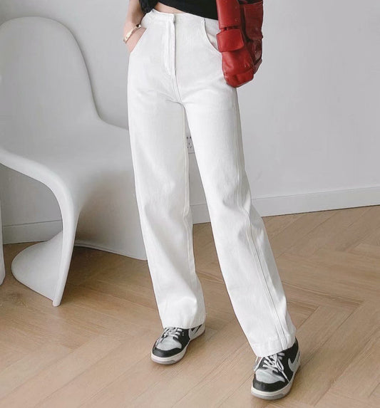Womens Banana Pants in white lightweight denim styled with a red jacket and casual sneakers