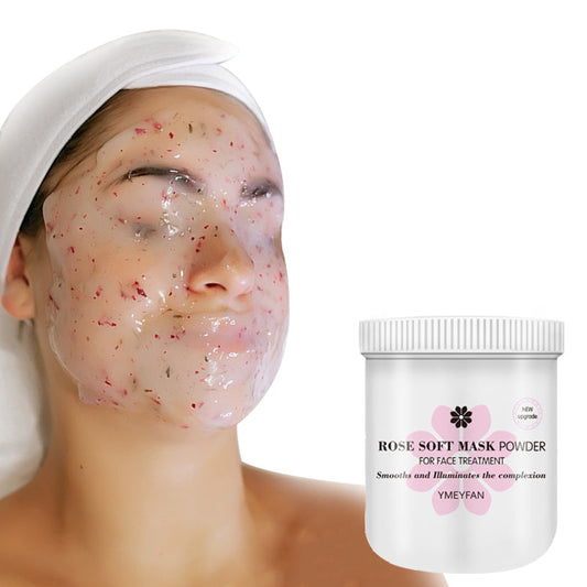 Person wearing a rose hydrojelly facial mask with a container of YMEYFAN Rose Soft Mask Powder nearby.
