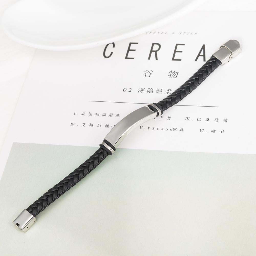 Braided Leather Cuff Bracelet in black displayed on a magazine